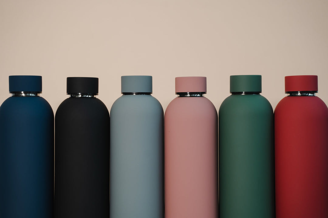 Assortment of colourful customised water bottles