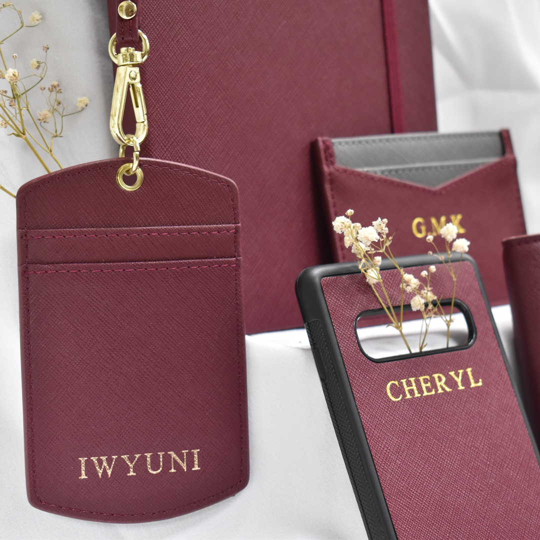 a collection of personalised gifts for her including leather cardholders phone cases and notebooks
