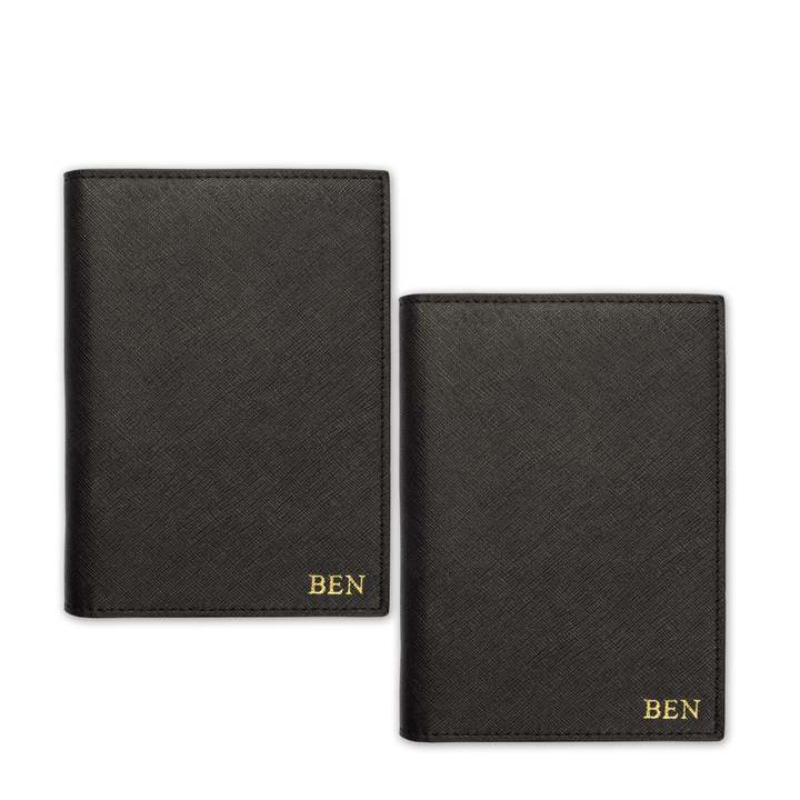 Two passport covers in black with gold ben text