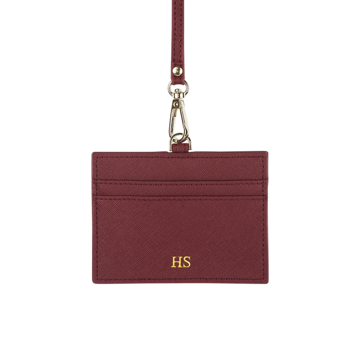 Saffiano horizontal ID cardholder lanyard in burgundy and with gold HS text
