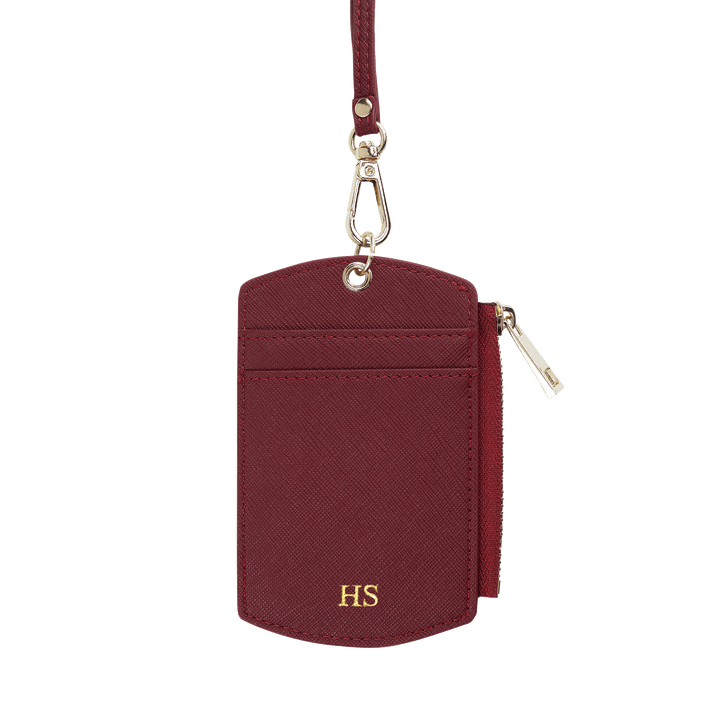 Saffiano ID cardholder lanyard in burgundy with gold HS text and side zipper